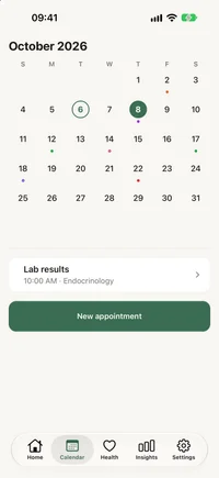 FichaMed monthly calendar with appointment days marked and the selected day’s schedule below.